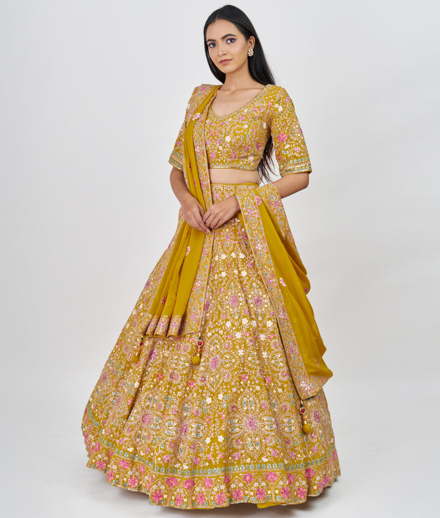 Mustrad Multi Color Thread Embroidery With Sequins And Pearl And Jarkan Stone Work  Lehenga